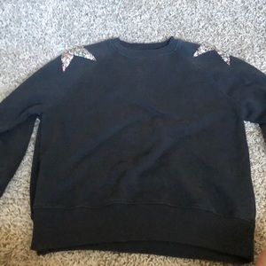 dark grey crewneck with jewel stars on the shoulders